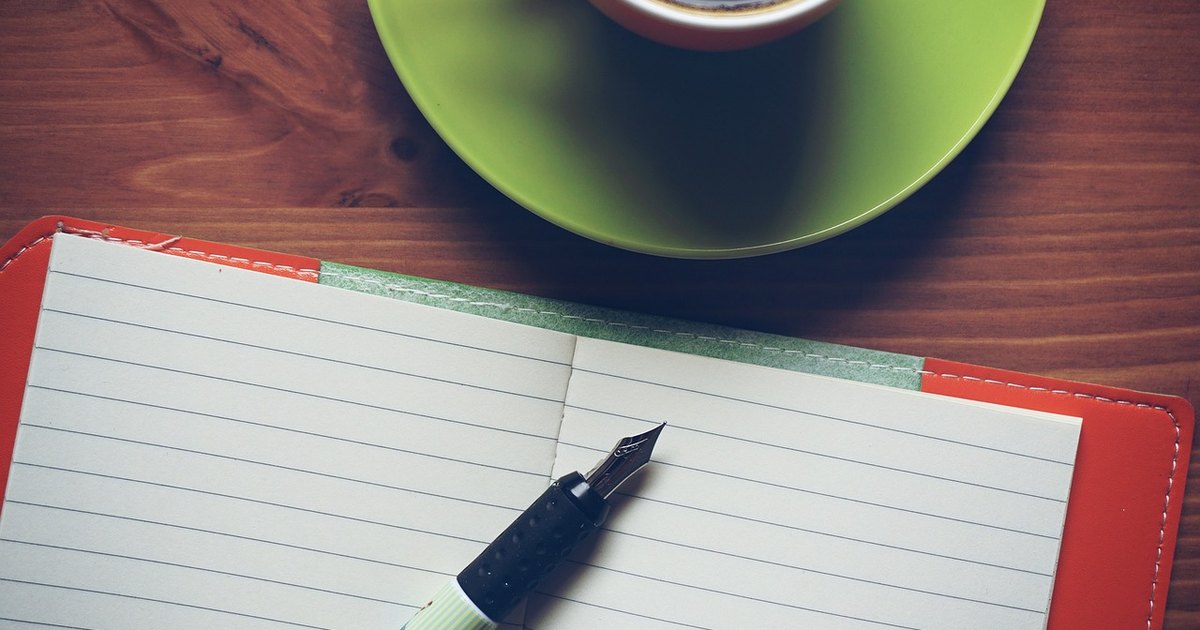 Inside bar breakout strategy - notebook pen coffee desk