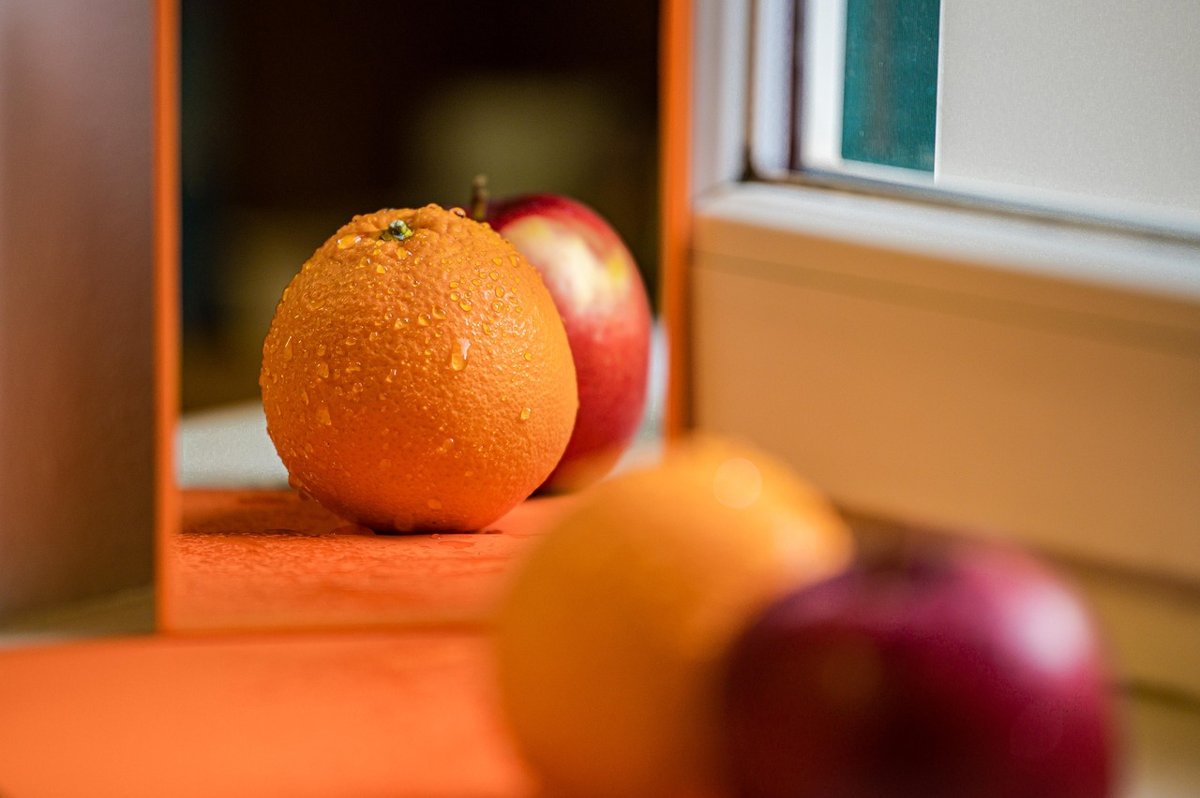 IPO valuation peer comparison: an orange and an apple side by side on a windowsill