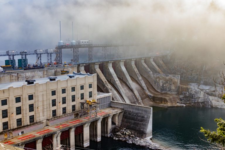 JP Power Q2 results: a hydroelectric dam and power house on a misty river