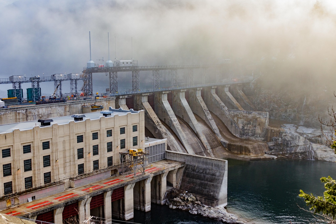 JP Power Q2 results: a hydroelectric dam and power house on a misty river