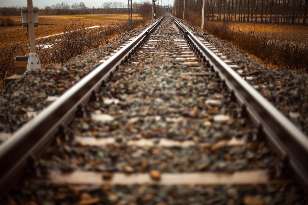 Keltner channel indicator concept: two parallel railway tracks running into the distance like upper and lower bands