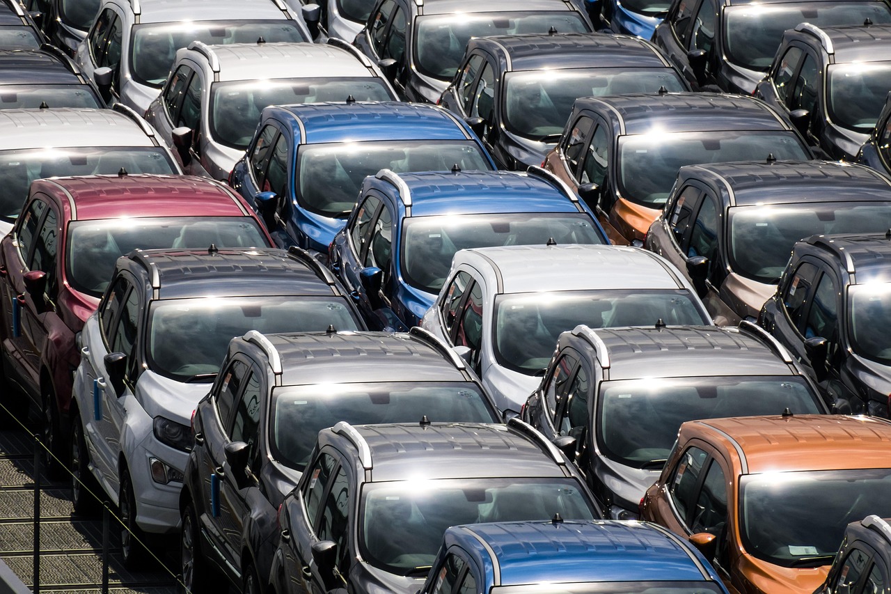 Maruti Suzuki Q2 results: rows of new cars parked at a vehicle yard