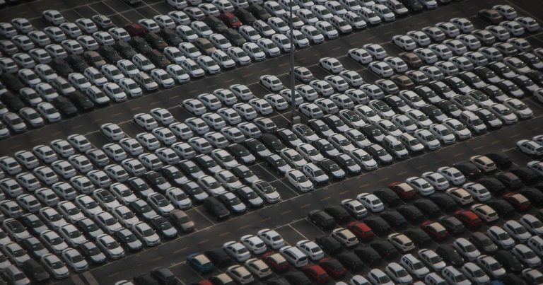 Monthly auto sales dispatch vs retail - cars parking lot