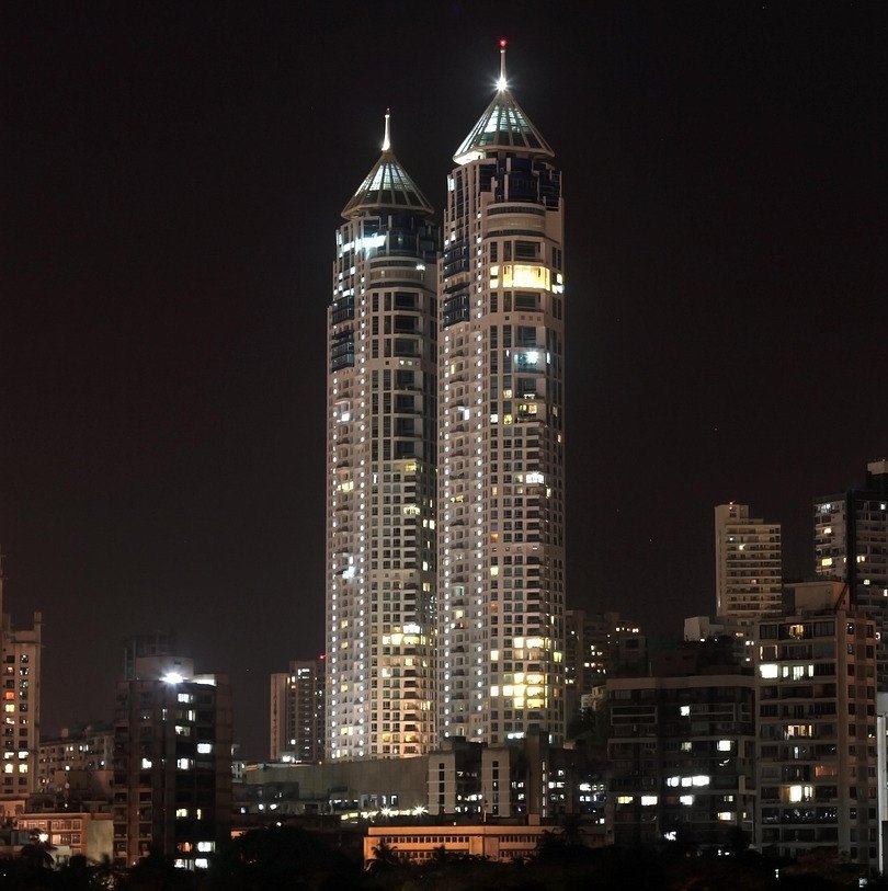 Sensex Nifty flat on October 27: Mumbai high-rise towers lit up against the night sky