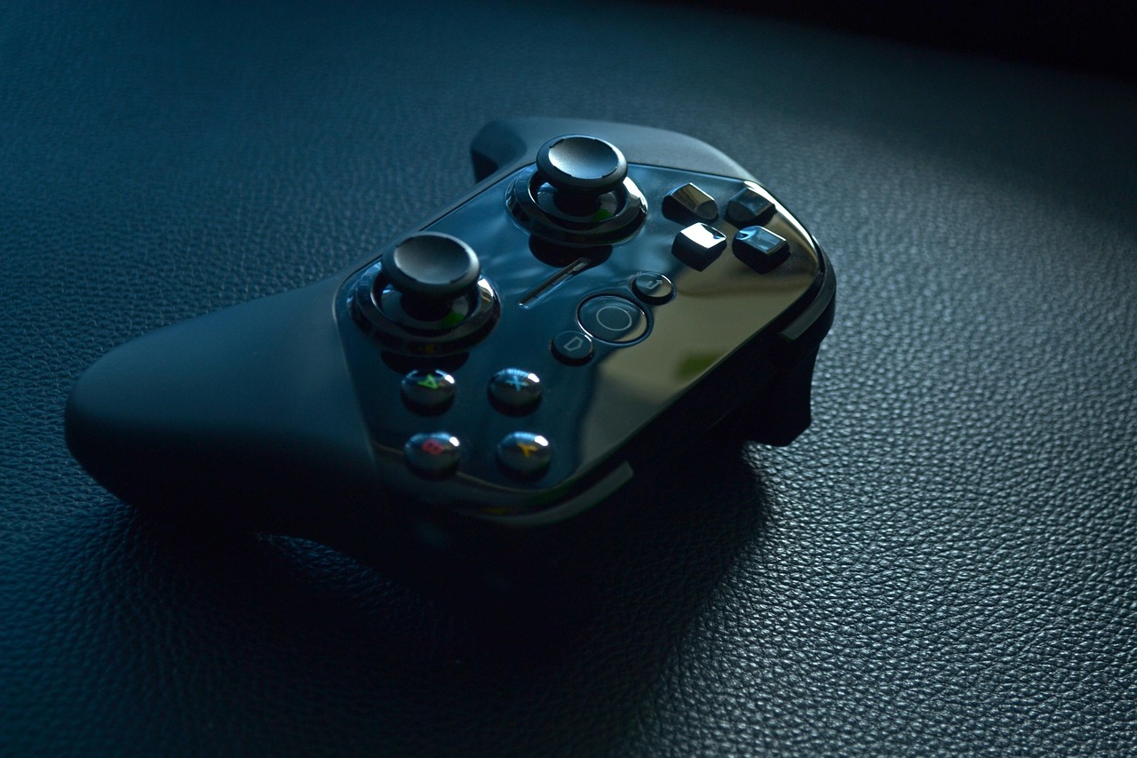 Nazara Technologies Q2 results: a black game controller resting on a dark leather surface
