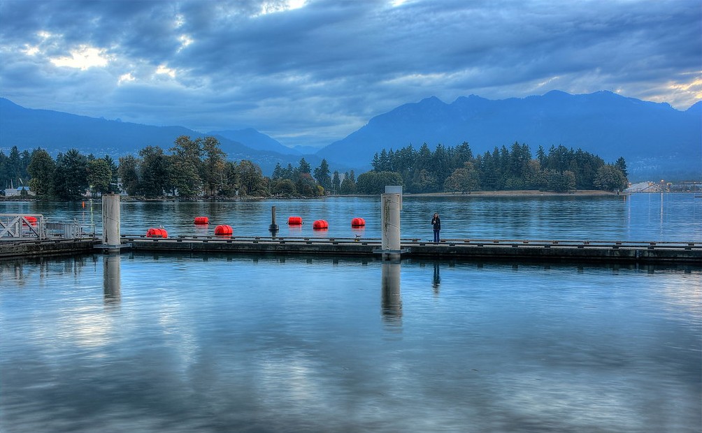 Negative volume index concept: a calm, quiet harbour at dawn with still water and moored floats