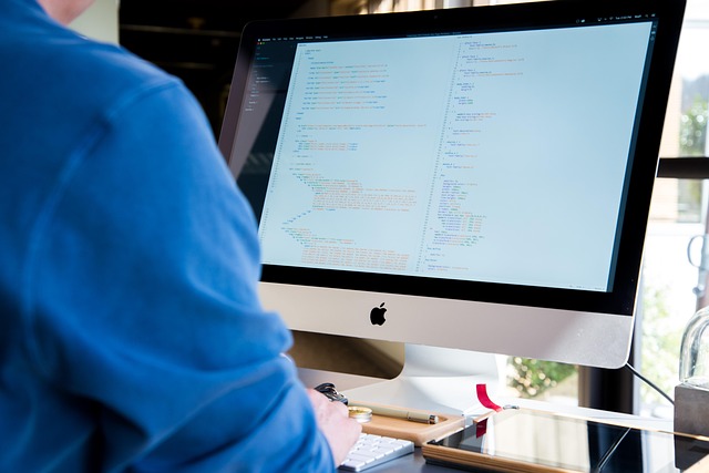 Nifty IT falls: software developer working at a desktop computer in an office
