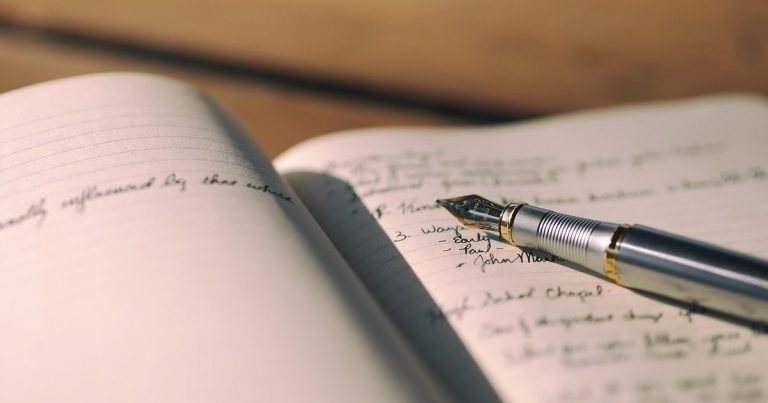 Nifty prediction tomorrow - person writing notes desk