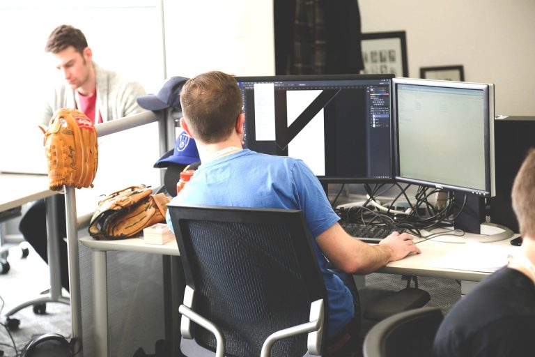 Hexaware dividend: software engineers at work in a modern IT office