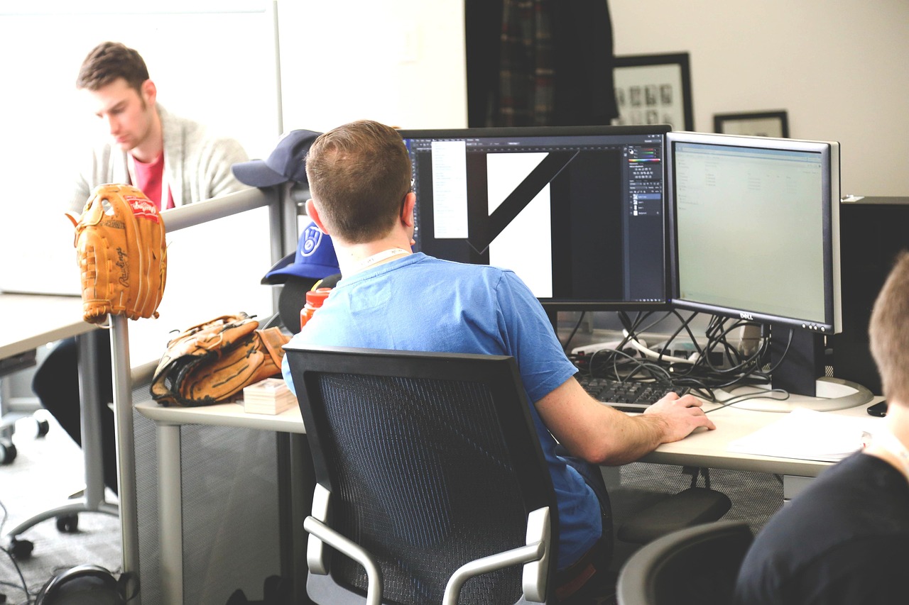 Hexaware dividend: software engineers at work in a modern IT office