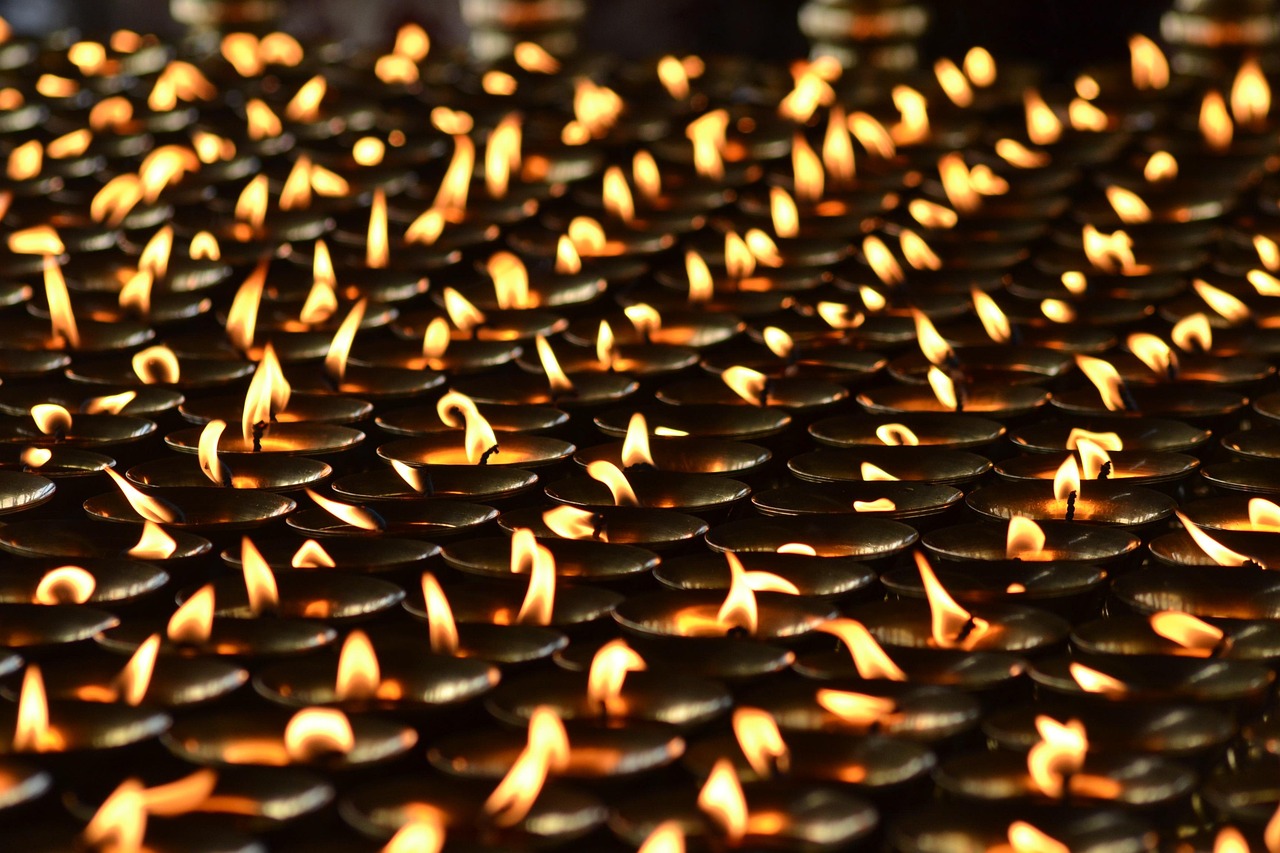 Samvat 2082 Nifty returns: rows of lit oil lamps glowing in the dark