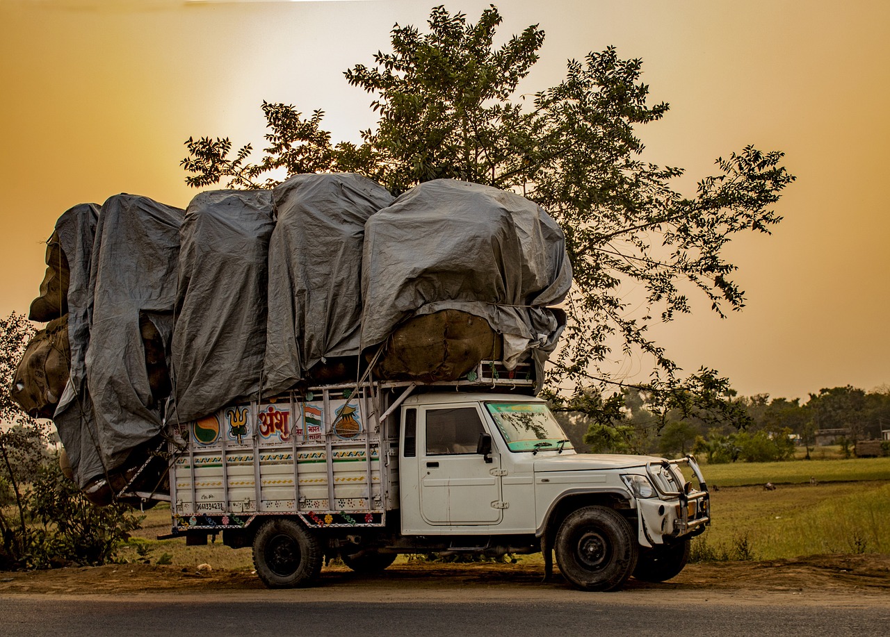 VRL Logistics buyback: a loaded goods truck parked on an Indian road at sunset