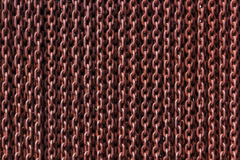 Promoter group meaning in an IPO: rows of interlinked rusty iron chains