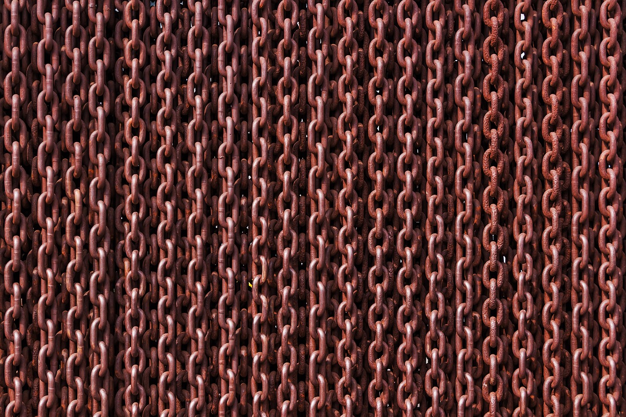 Promoter group meaning in an IPO: rows of interlinked rusty iron chains