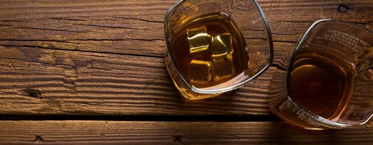 Radico Khaitan Q2 results: two glasses of whisky on a wooden table