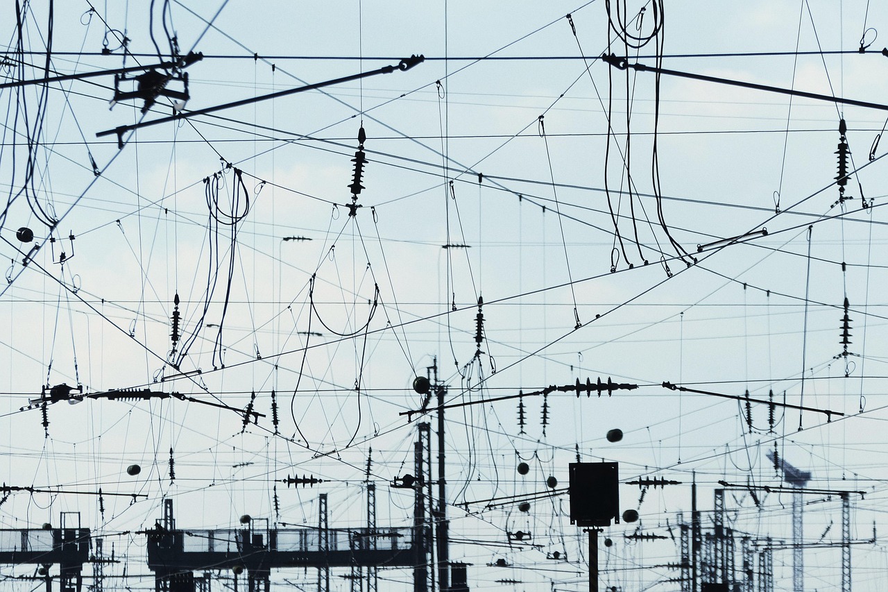 RailTel Q2 results: overhead railway cables and electrical lines criss-crossing above a station yard