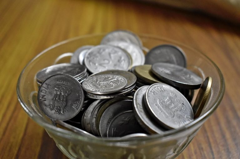 Indian rupee coins on a table for the RBI October 2026 policy update