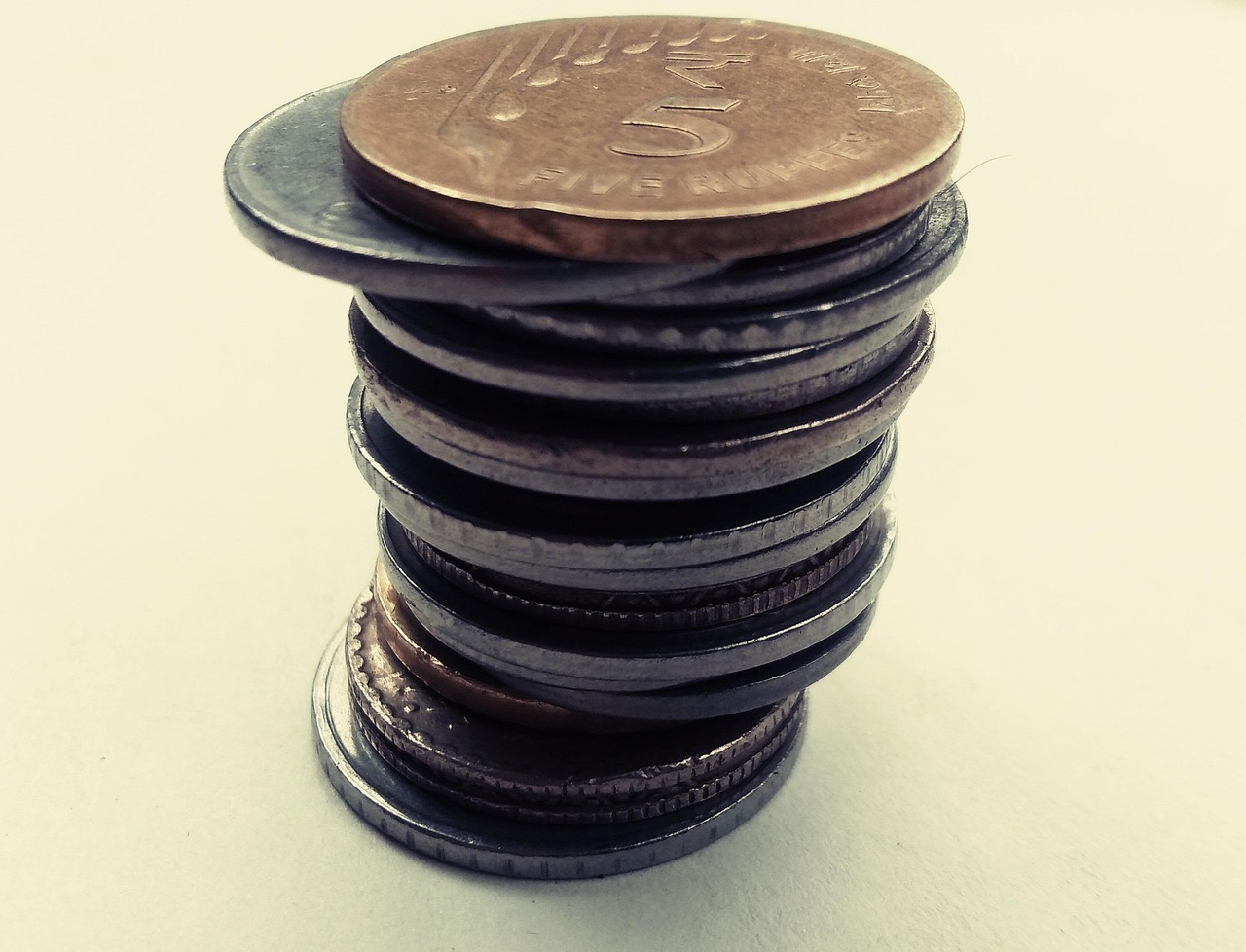RBI VRR auction: a stack of Indian rupee coins on a plain table
