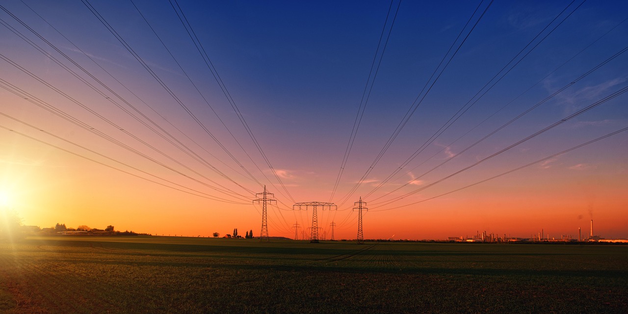 REC Q2 results: high-voltage power lines at sunset