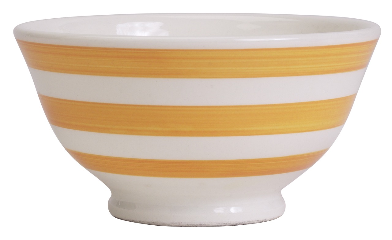 Rounding bottom pattern: an empty white bowl with orange stripes, its U-shaped curve echoing a saucer base