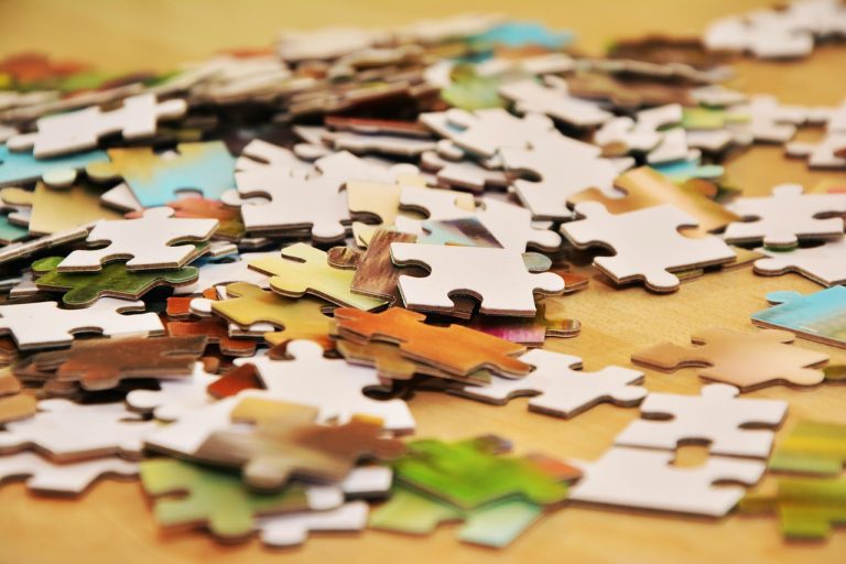 Scheme of arrangement concept: scattered jigsaw puzzle pieces waiting to be fitted together