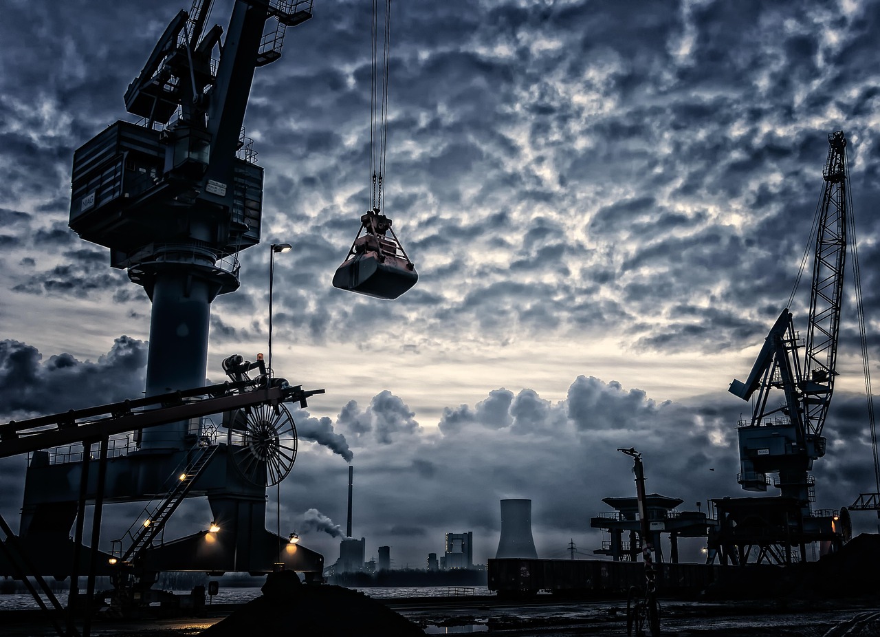 Sector rotation strategy: port cranes and an industrial skyline under a cloudy sky
