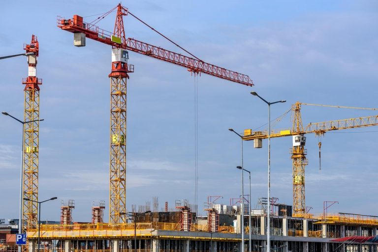 Sobha Q2 results: tower cranes over a residential building under construction