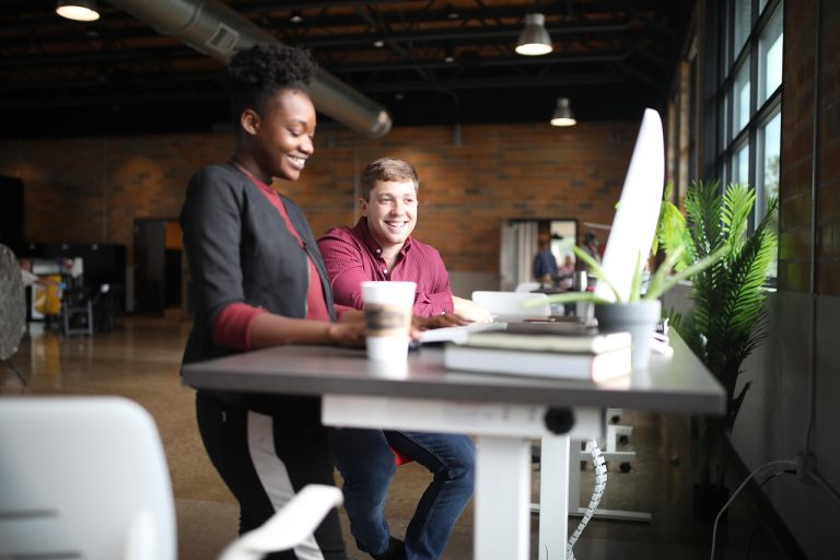 IOB ESPS: two employees working together at a desk in an office
