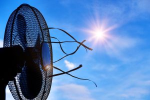 Symphony Q2 results: an electric fan cooling against a bright summer sun