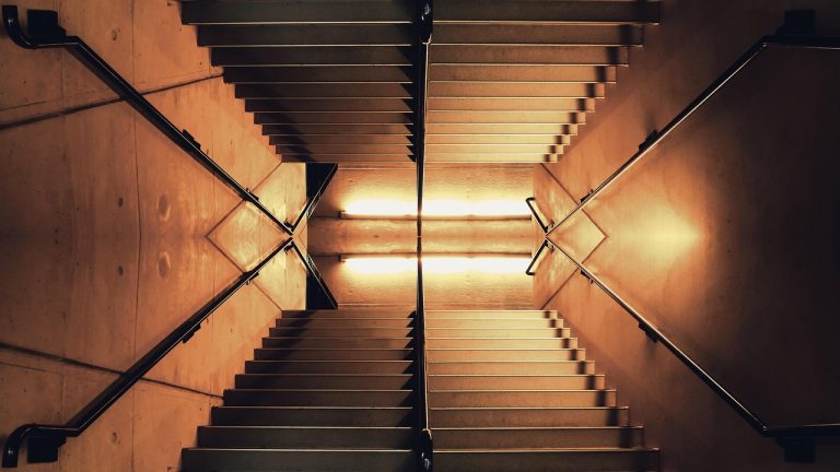 Tick size for NSE stocks: an evenly spaced lit concrete staircase seen from above, each step a fixed height