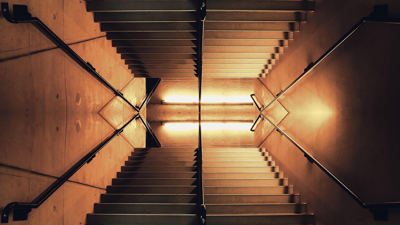 Tick size for NSE stocks: an evenly spaced lit concrete staircase seen from above, each step a fixed height