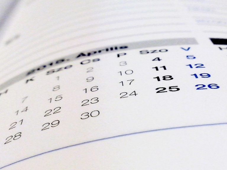 Turn of the month effect concept: close-up of a printed monthly calendar page with the dates of the month