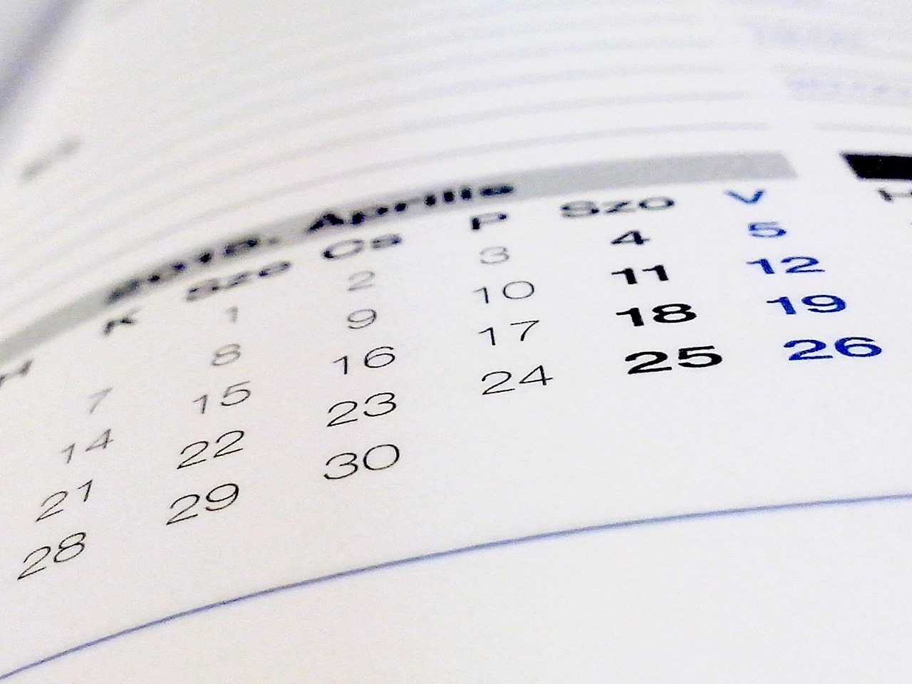 Turn of the month effect concept: close-up of a printed monthly calendar page with the dates of the month