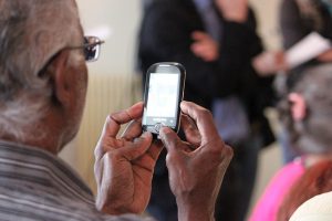 UPI mandate in IPO: an older man approving a request on his mobile phone