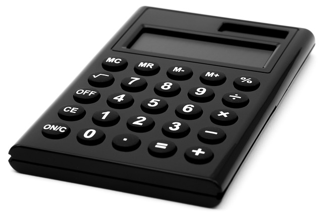 Yield to call: a black pocket calculator on a white background