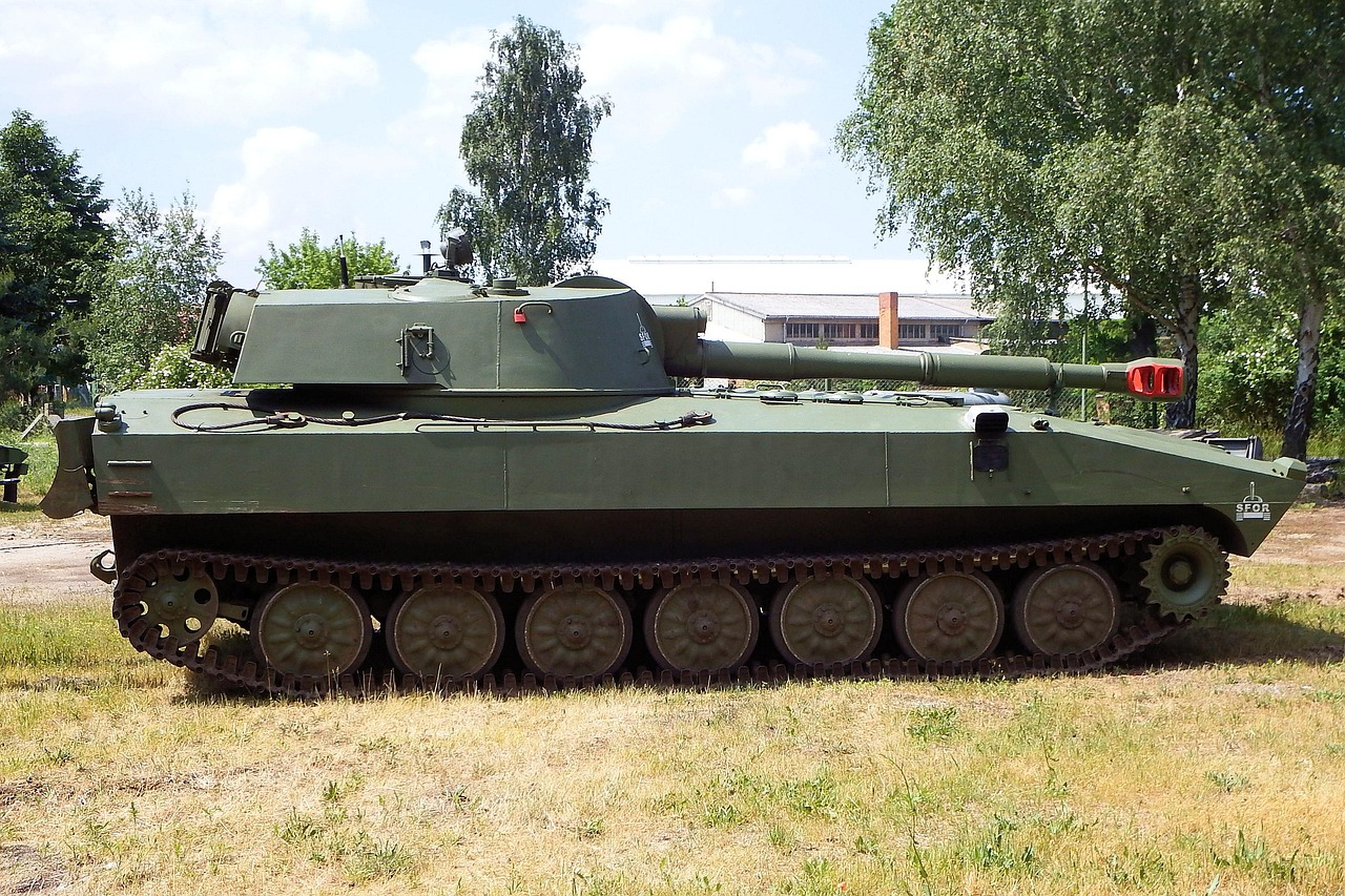 Zen Technologies Cogknit acquisition: a green tracked armoured vehicle parked on grass